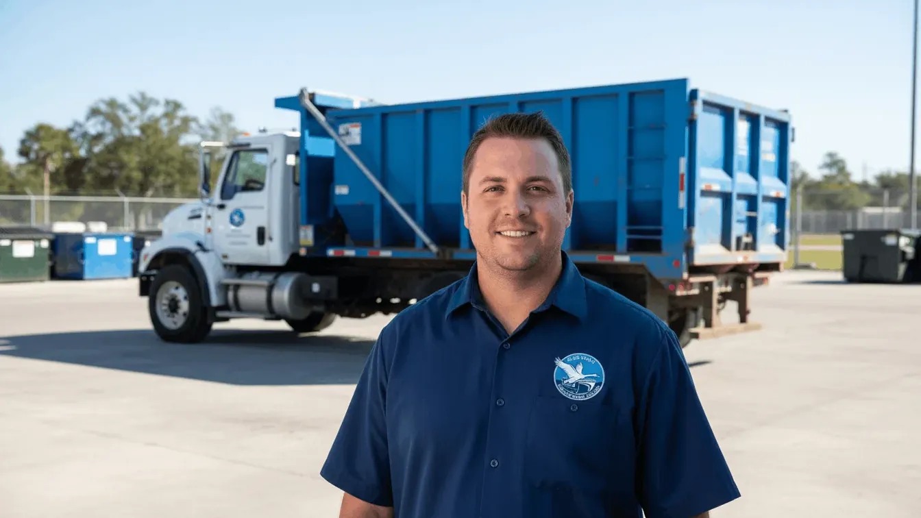 Driveway protection on dumpster delivery in Lakeland, Florida — plywood laid under the wheels and the rails Driveway protection on dumpster delivery in Lakeland, Florida — plywood laid under the wheels and the rails