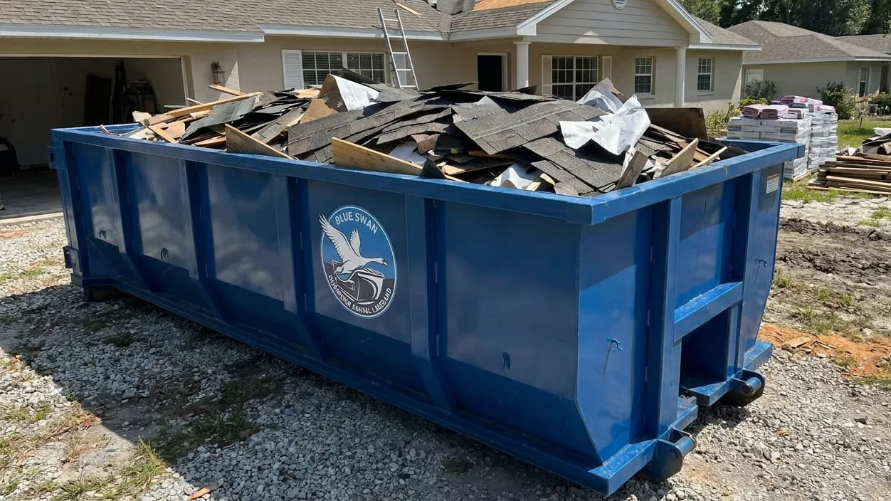 Storm debris cleanup in Lakeland, Florida — wind and rain debris loaded after a storm crosses the peninsula Storm debris cleanup in Lakeland, Florida — wind and rain debris loaded after a storm crosses the peninsula